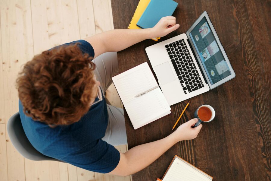 Person watching movie home laptop notebook coffee