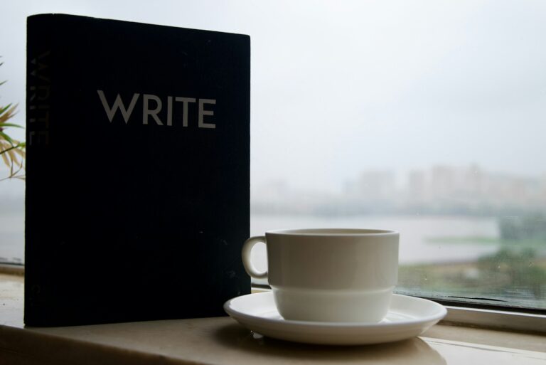 Cup tea book rainy window