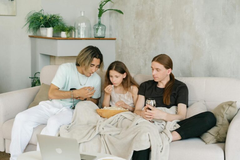 Couple watching movie couch family movie night living