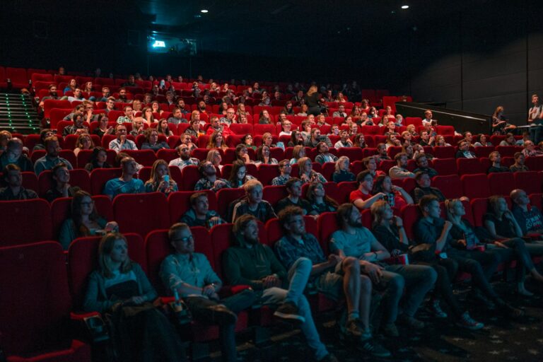 Movie character close dramatic lighting cinema audience watching